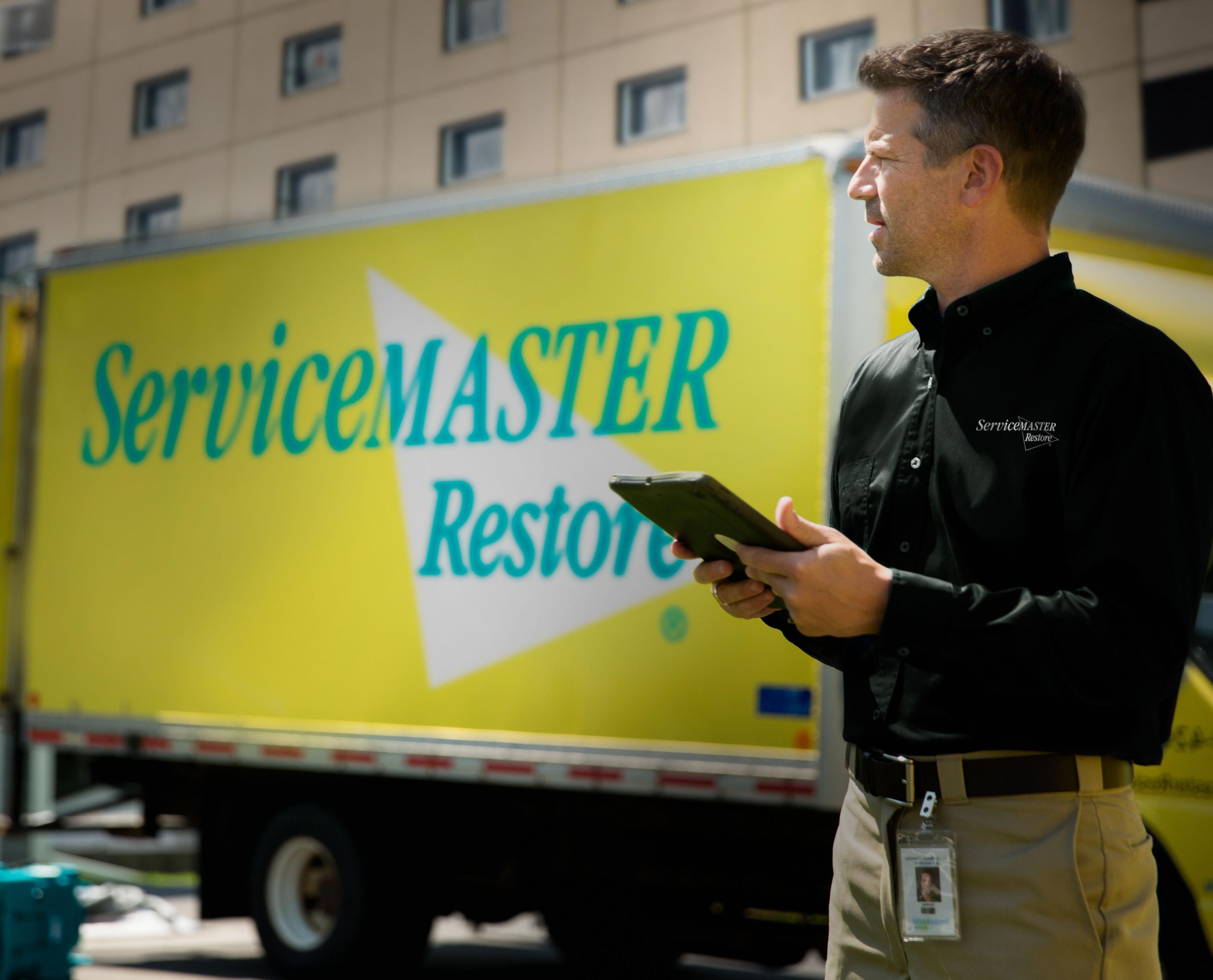 ServiceMaster Restoration By Simons Technician Assessing Fire Damage on Site in Chicagoland