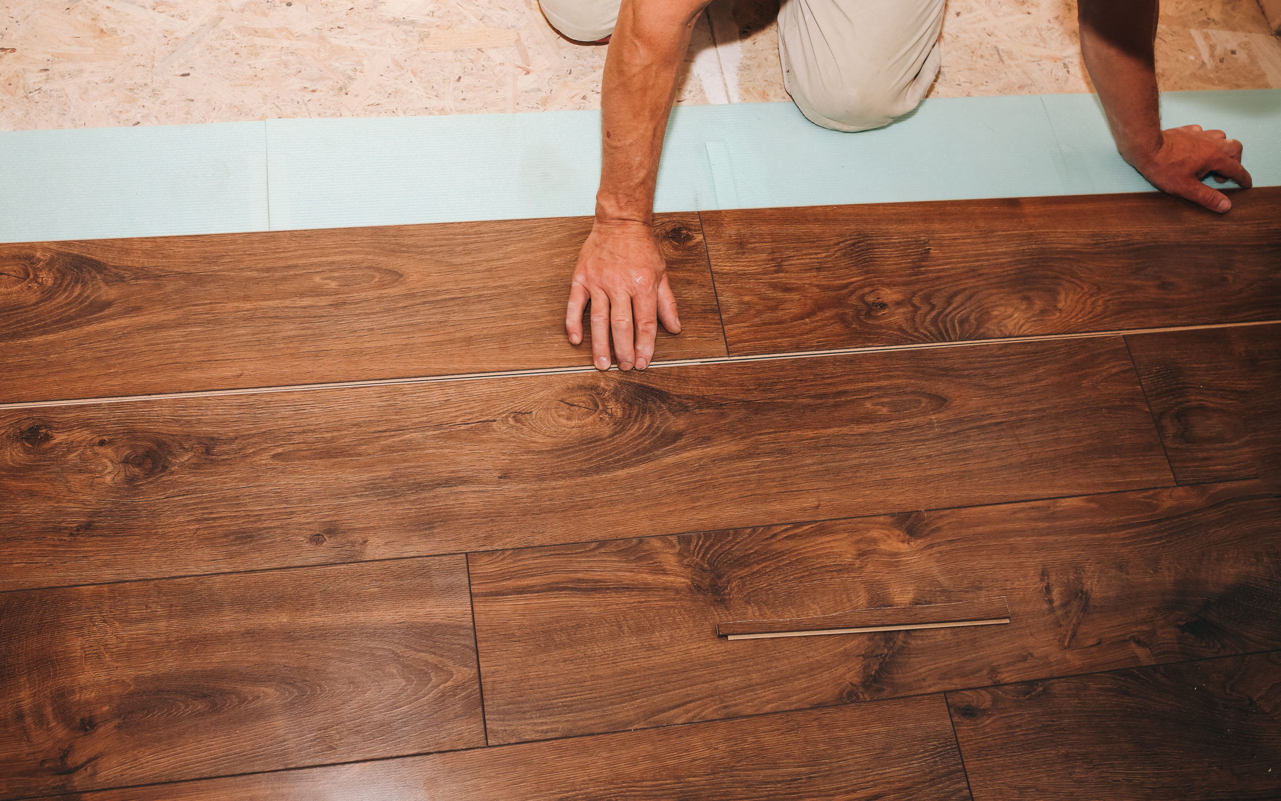 Hardwood Floor Restoration - Wood Floor Water Damage - Wood Floor Damage due to Water - Wood Floor Drying System - Water Damage to Wood Floor - Wood Floor Rescue - ServiceMaster Restoration By Simons. Photo of an oak floor affected by water damage